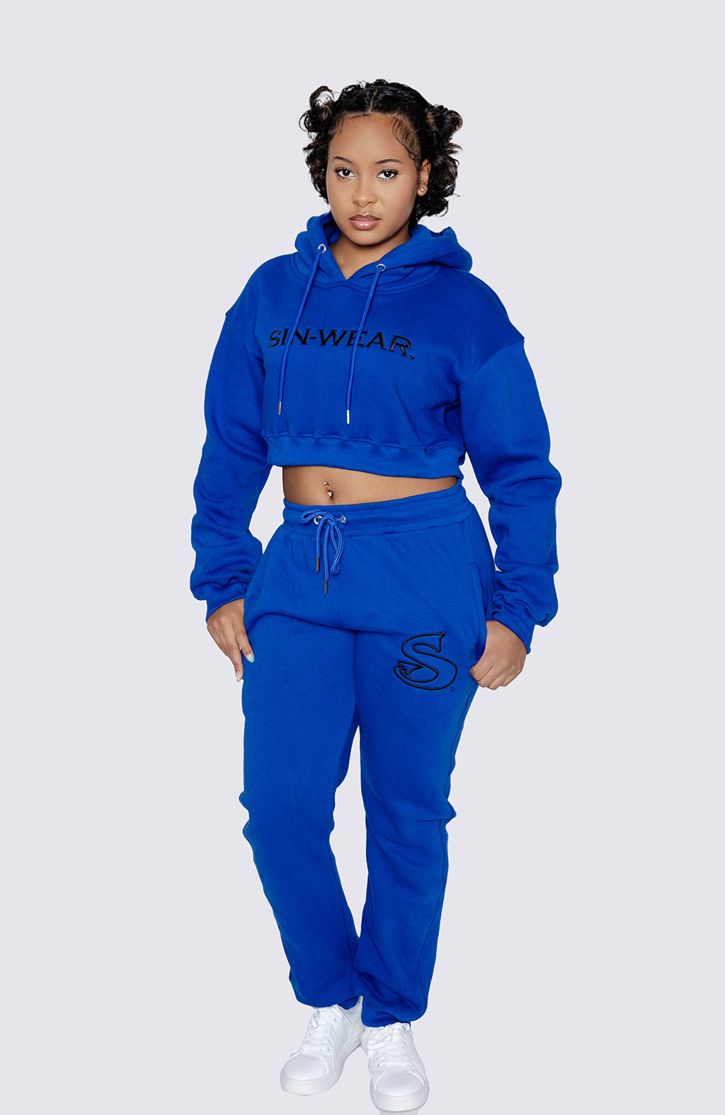Person wearing a blue hoodie and pants with 'Sin-Wear' branding on a white background