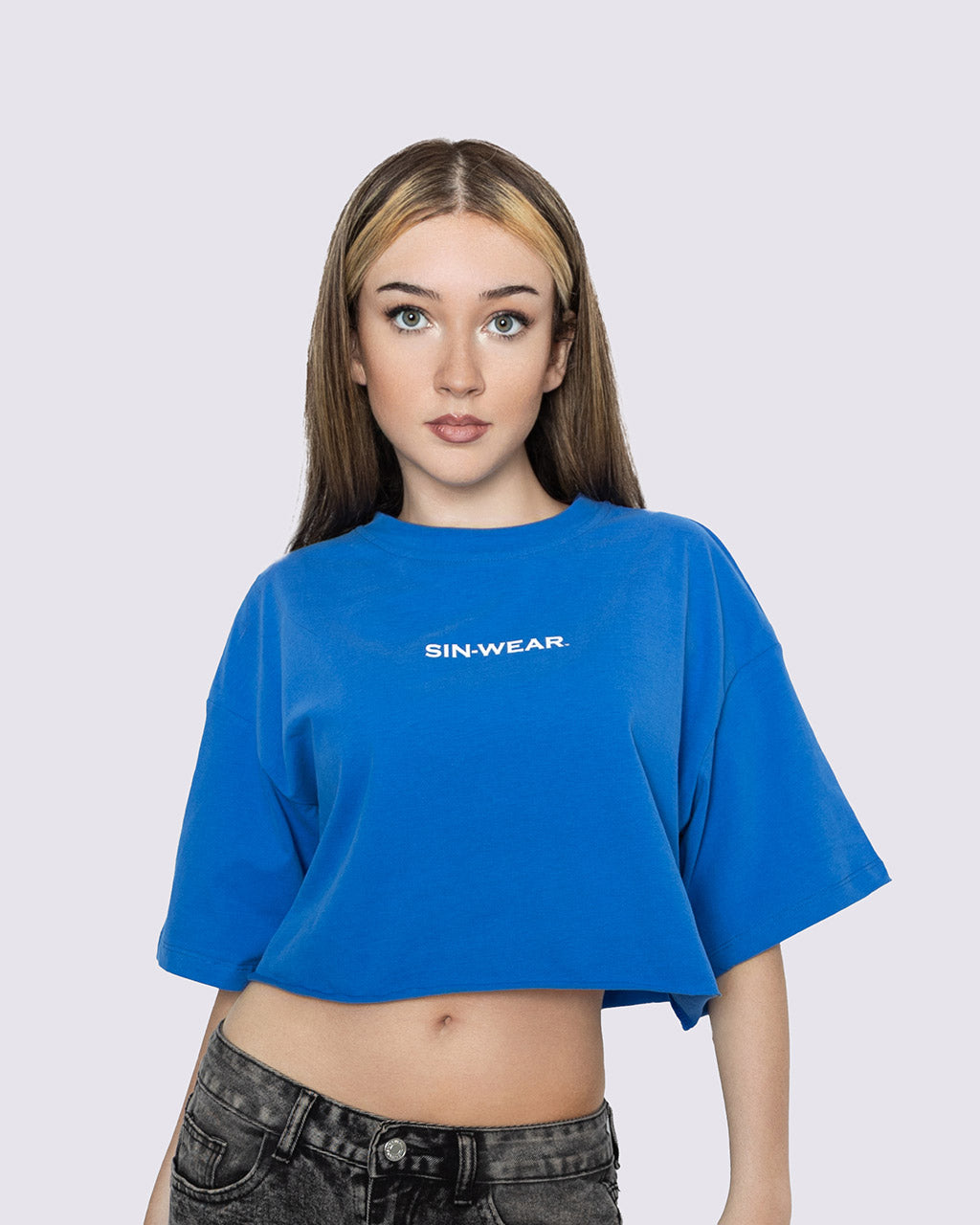 Person wearing a blue 'SIN-WEAR' t-shirt on a white background