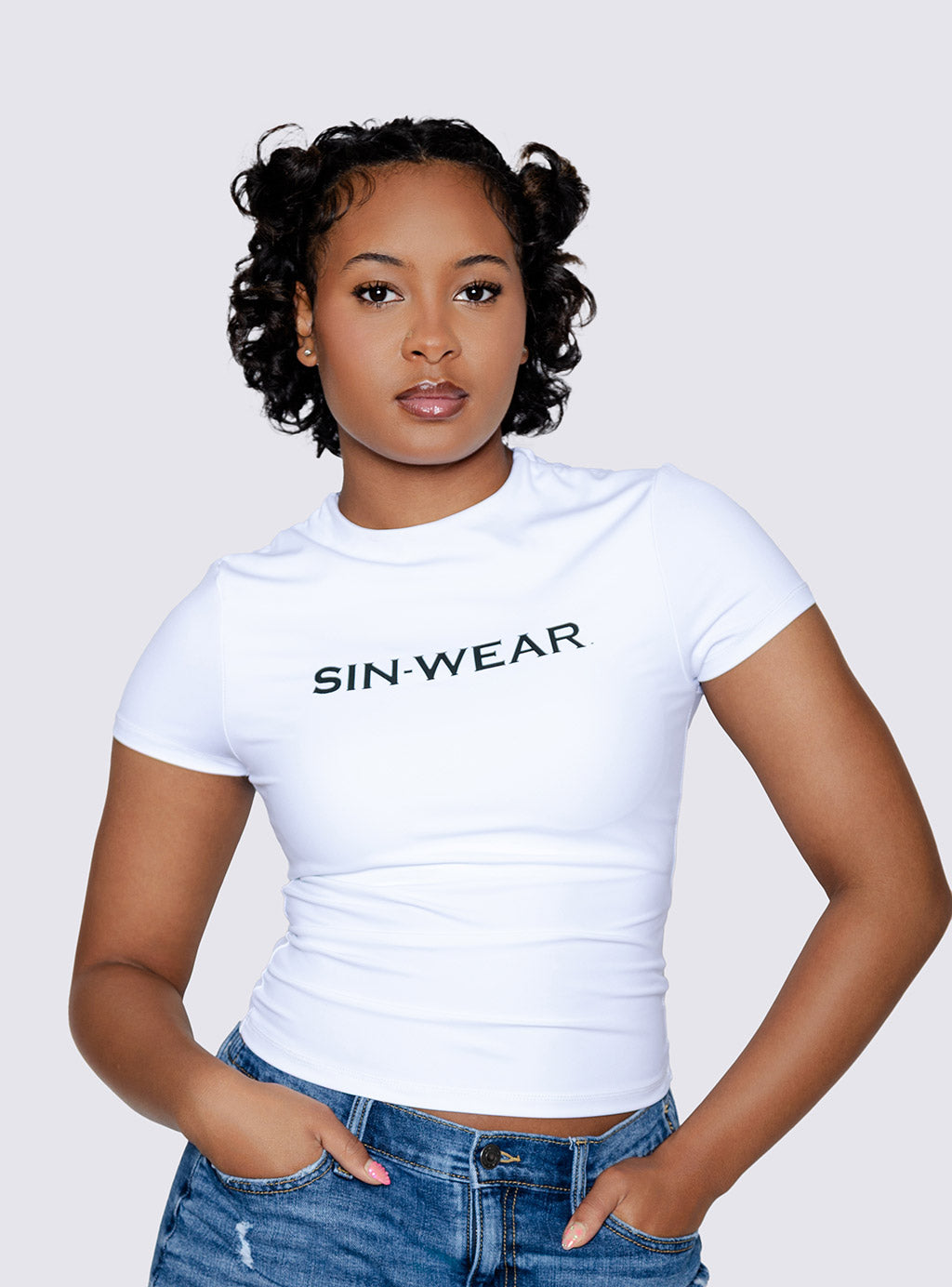 Person wearing a white dry fit t-shirt with 'SIN WEAR' text on a plain background