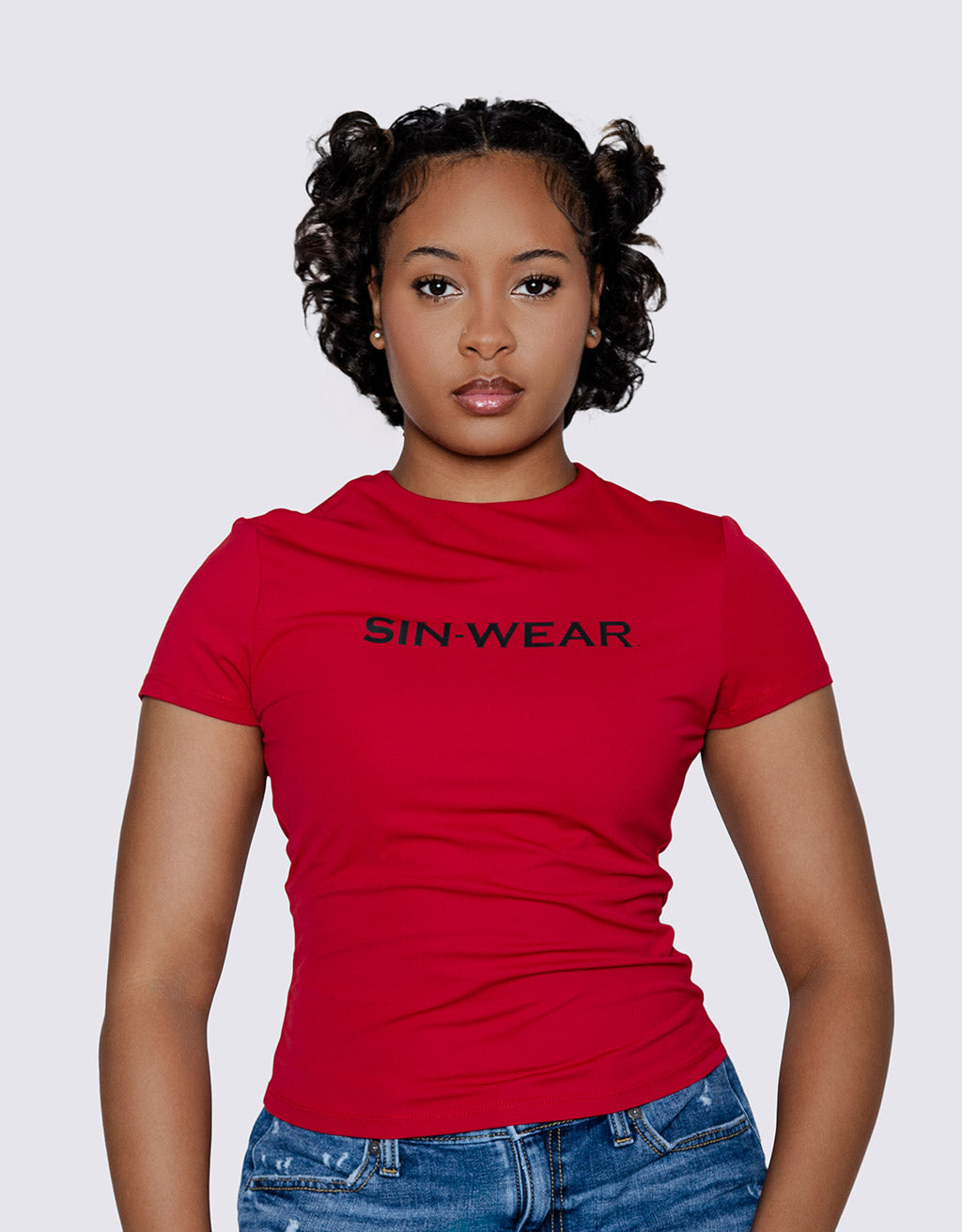 Person wearing a red dry fit t-shirt with 'SIN-WEAR' text on a plain background