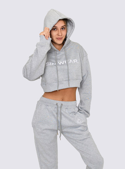 Person wearing a gray hoodie and pants with 'Sin-Wear' branding on a white background