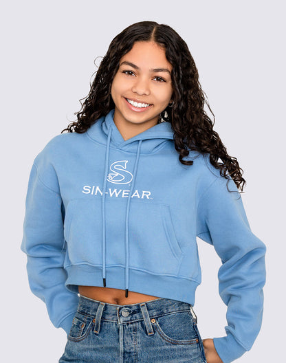 Person wearing a blue crop hoodie with 'Sin-Wear' logo on a light gray background