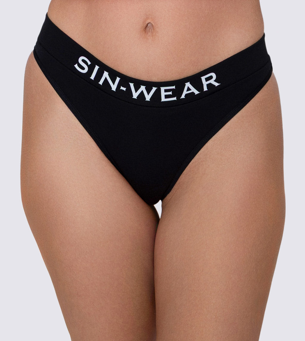 Black underwear with 'SIN-WEAR' waistband on a neutral background