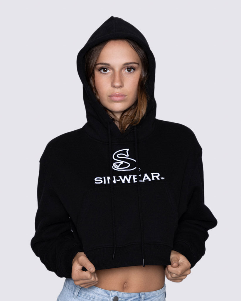 Person wearing a black crop hoodie with 'Sin-Wear' logo on a white background